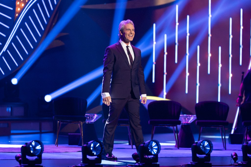Andy Cohen standing on stage at BravoCon 2025