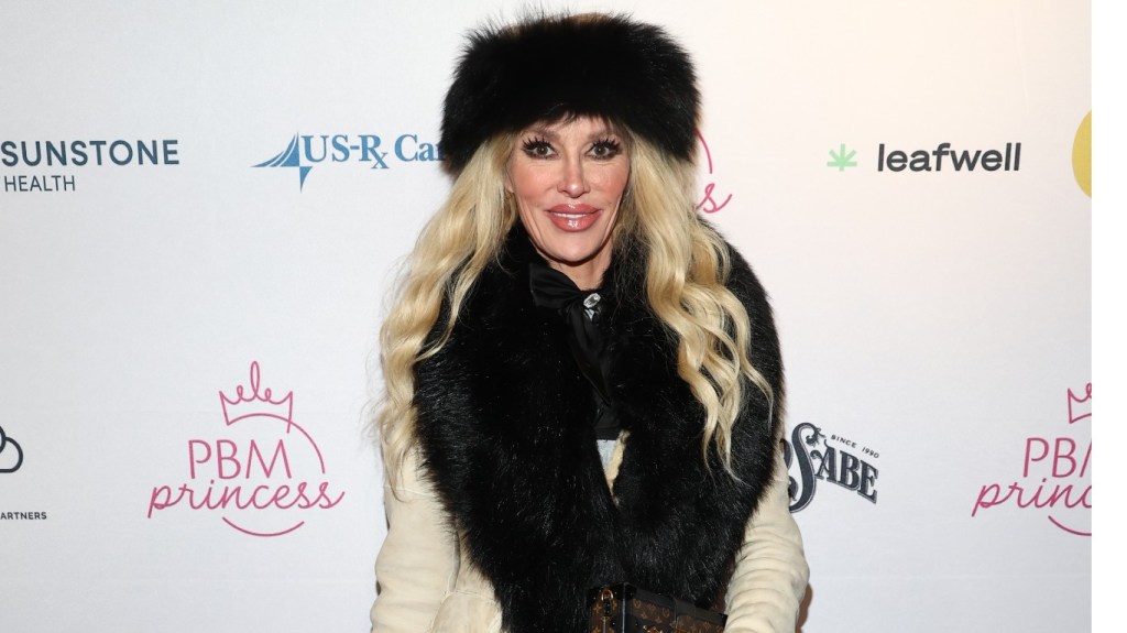 Brandi Glanville in a black fur hat and stole