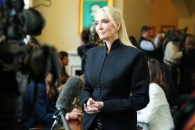 Erika Jayne in a black suit giving an interview at Capitol Hill