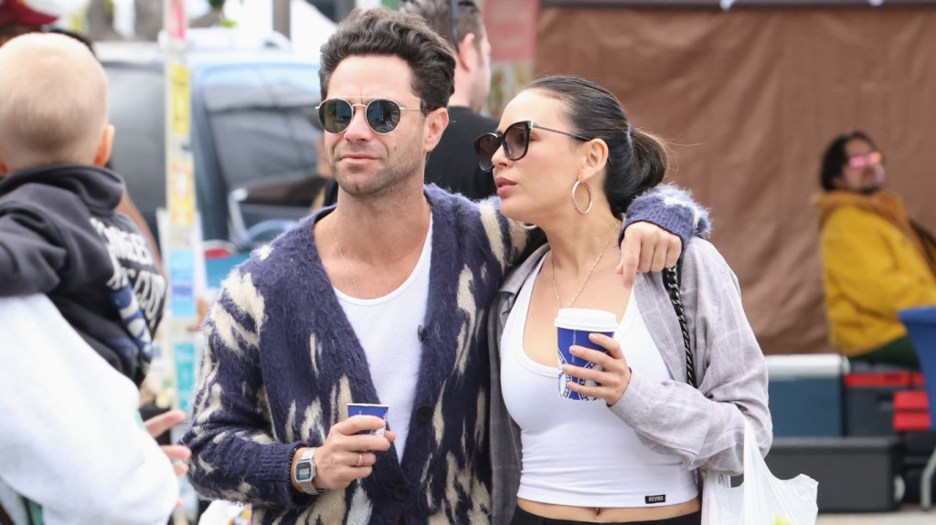 Sasha Farber with his arm around Janel Parnish
