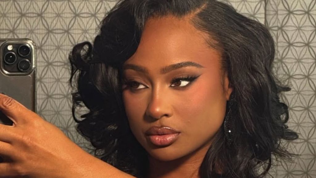 Travis Kelce’s Ex Turns Heads in Slit Dress That Puts Her Legs Fully on Display