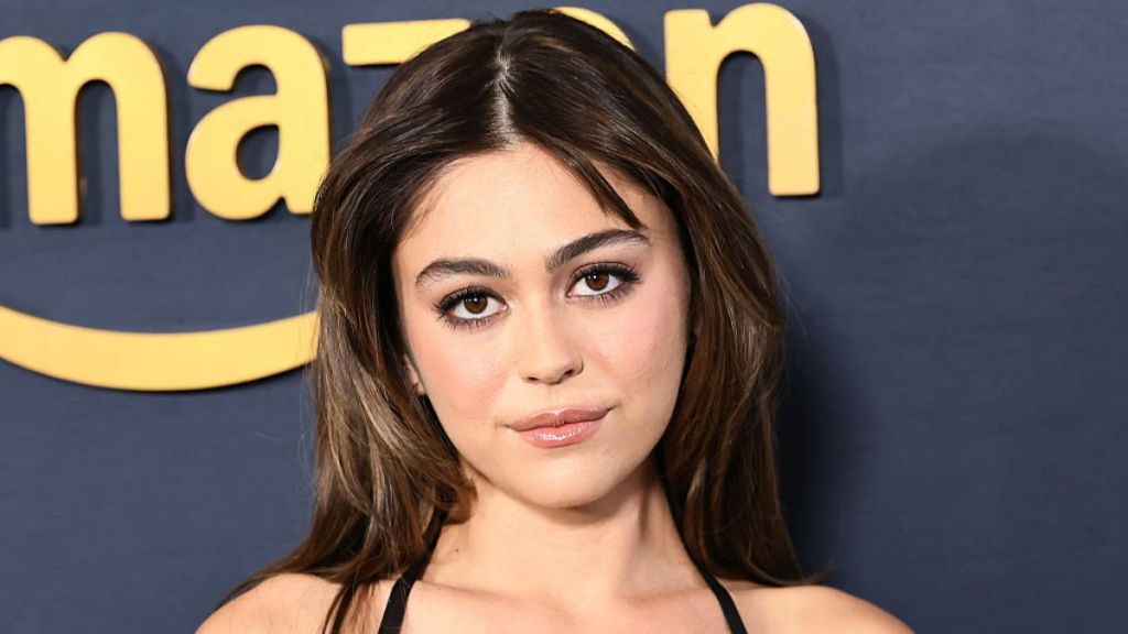 Mika Abdalla’s Robe Dress’ Plunging Neckline Runs So Deep It Exposes Her Navel