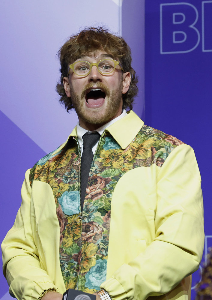 West WIlson in a yellow jacket at BravoCon with his mouth wide open