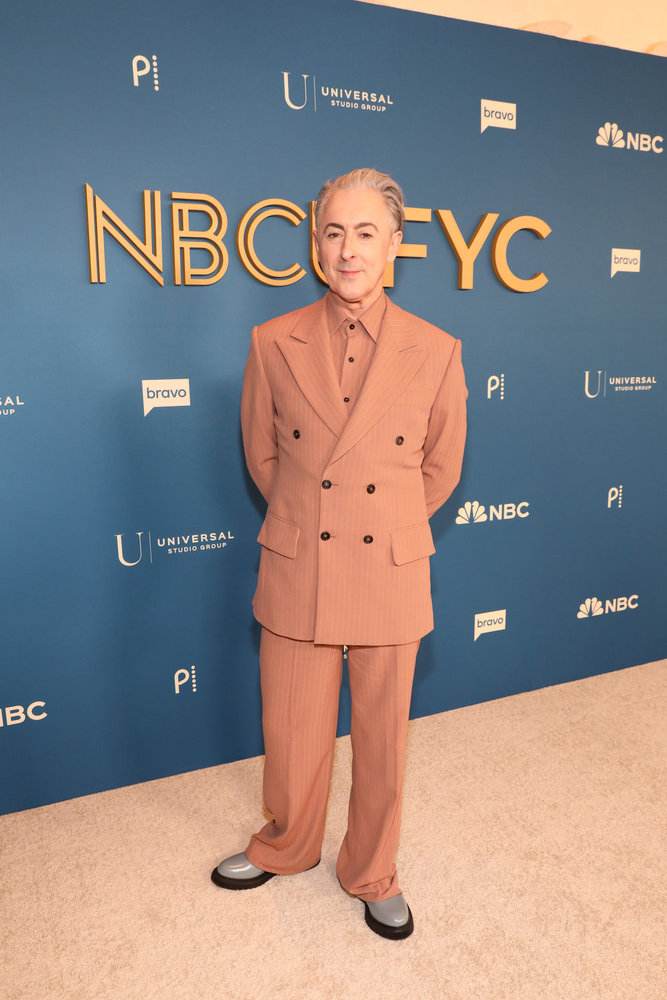 Alan Cumming at the NBCUniversal FYC Emmy Luncheon in a brown suit 