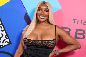 Nene Leakes Almost Squeezes Out of Her Sheer Neckline High-Cut Dress