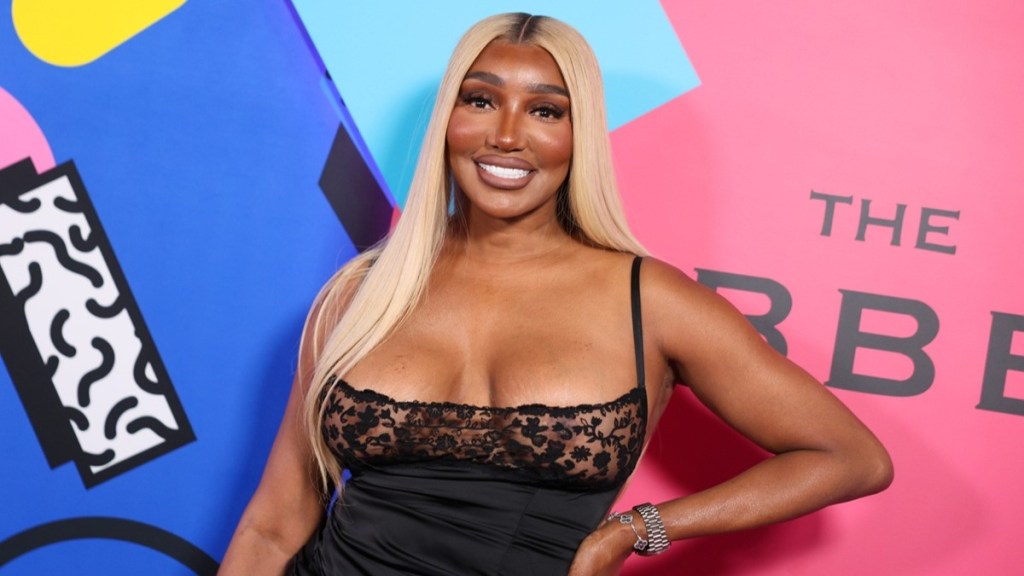 Nene Leakes Almost Squeezes Out of Her Sheer Neckline High-Cut Dress