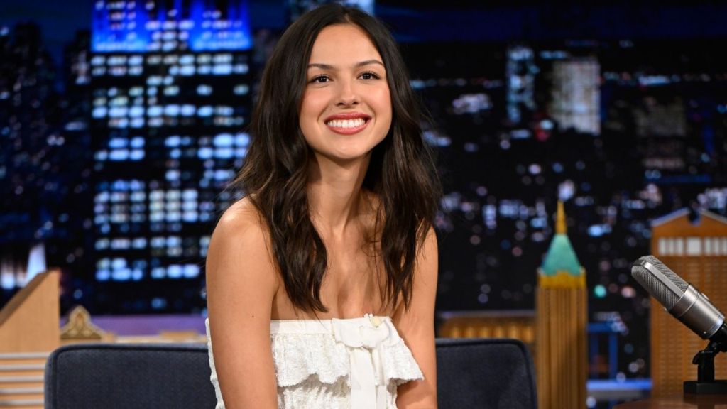 Olivia Rodrigo Turns Heads in Plunging Metallic Anna Sui Dress & Gucci Pumps