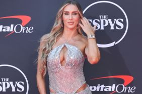Charlotte Flair Lifts Her Teeny Tiny Shorts to Reveal Toned Thighs