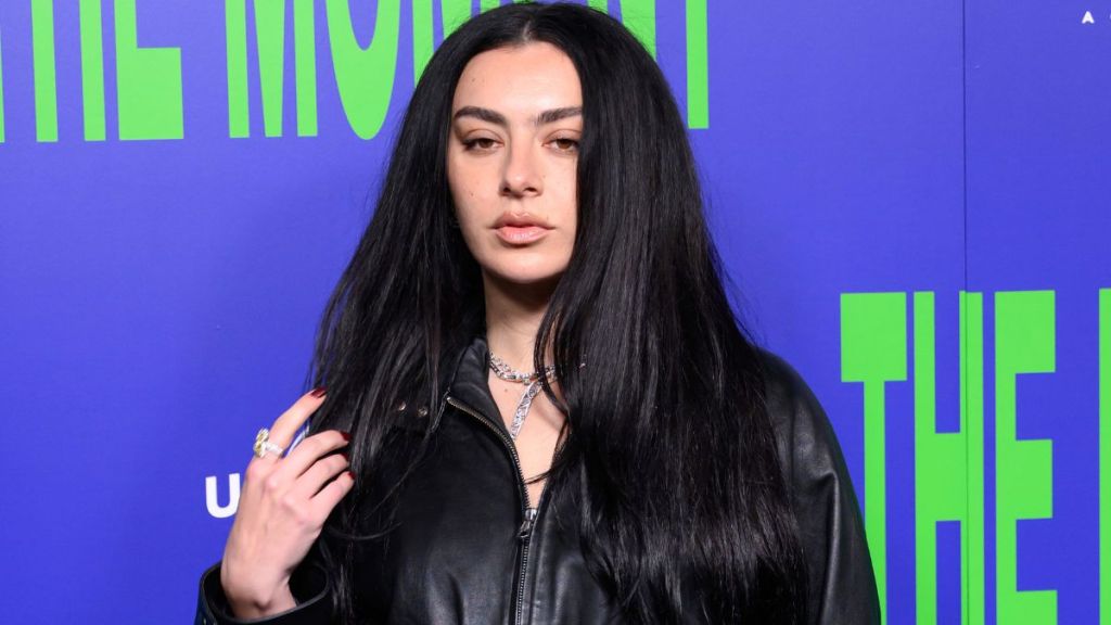 Charli XCX's Jacket Can Barely Contain Her Daring Bra Look