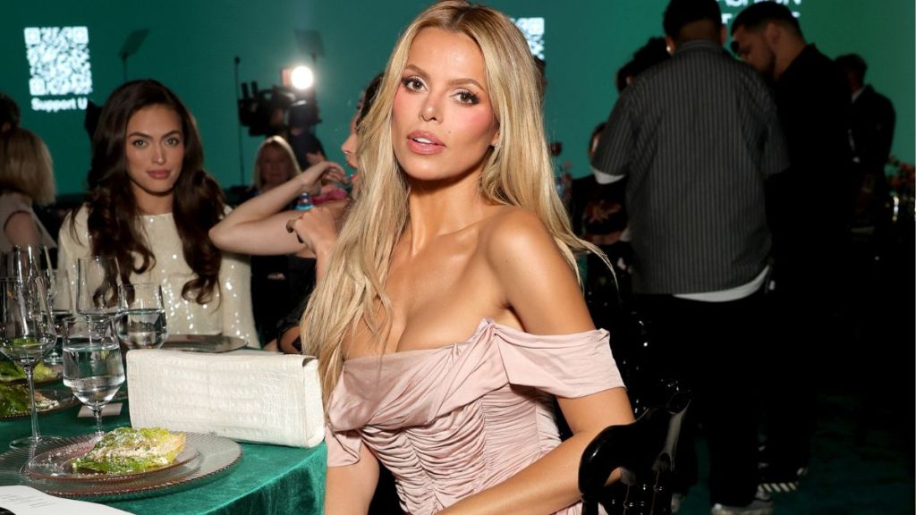Brooks Nader’s Plunging Christopher Esber Dress Dips Dangerously Low