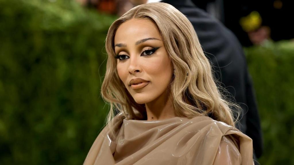 Doja Cat's Plunging Saint Laurent Top Dips Dangerously Low Uniquely