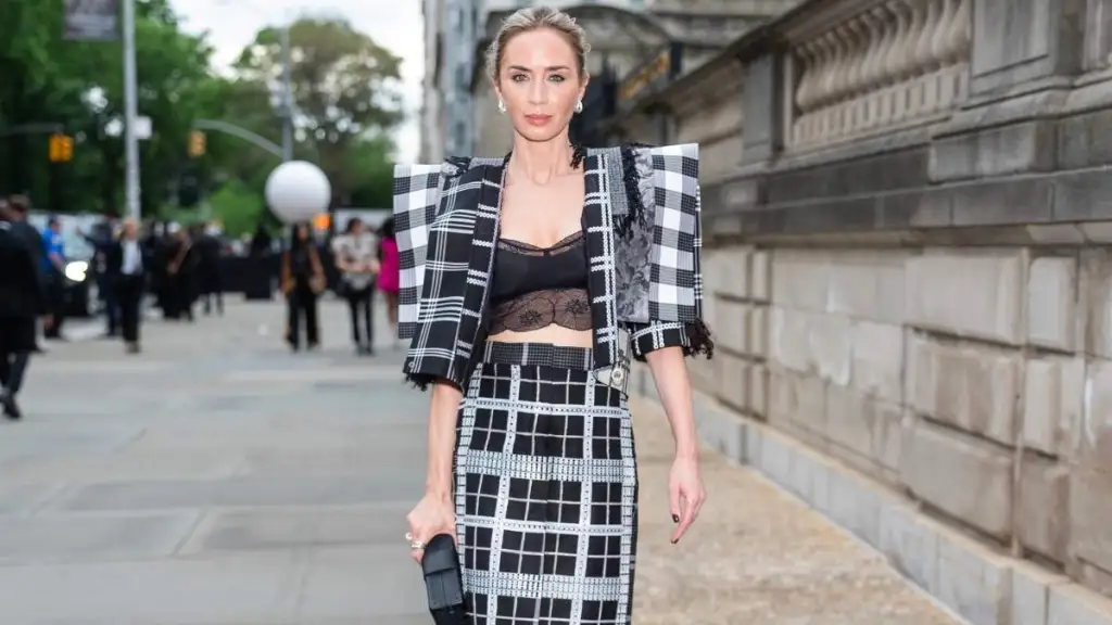 Emily Blunt Tries Peekaboo Bra Trend in Open Louis Vuitton Jacket Look