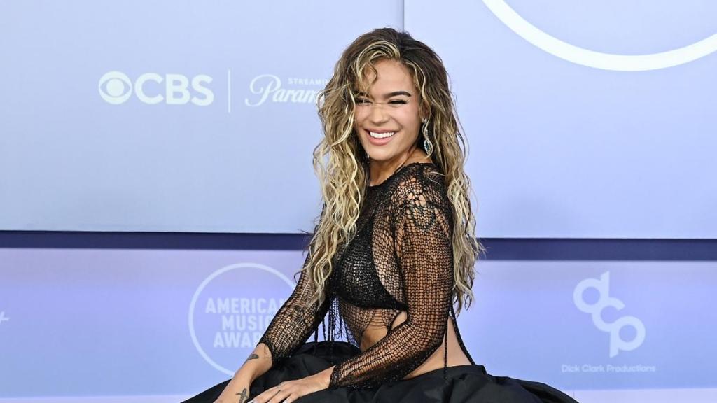 Karol G's Bikini Top Peeks Through See-Through Natalia Fedner Chain Top