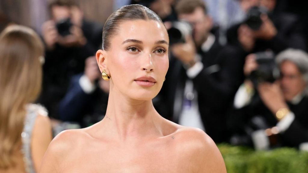 Hailey Bieber Cheekily Tucks Rhode Product Into Her Daring Bikini