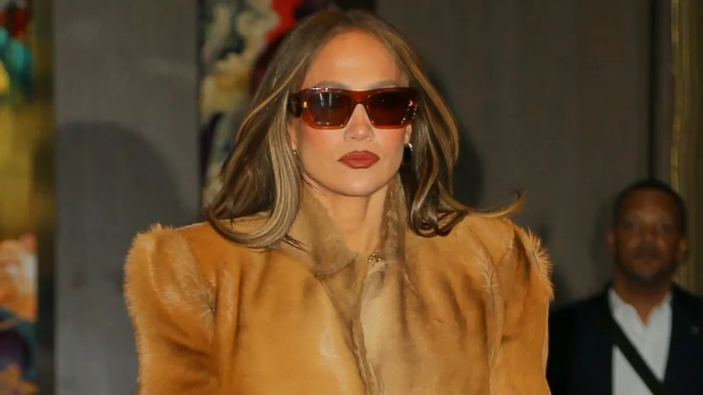 Jennifer Lopez Nails Peekaboo Bra Trend in 2-Button Jacket