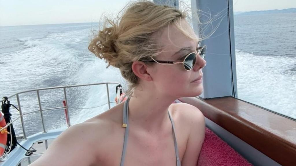 Elle Fanning Wears Nothing But Thong & Bandana on Vacay