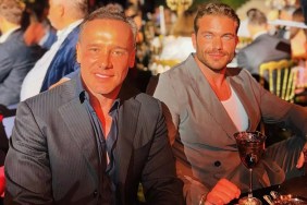 Lenny Hochstein and a friend sitting at a table at a gala