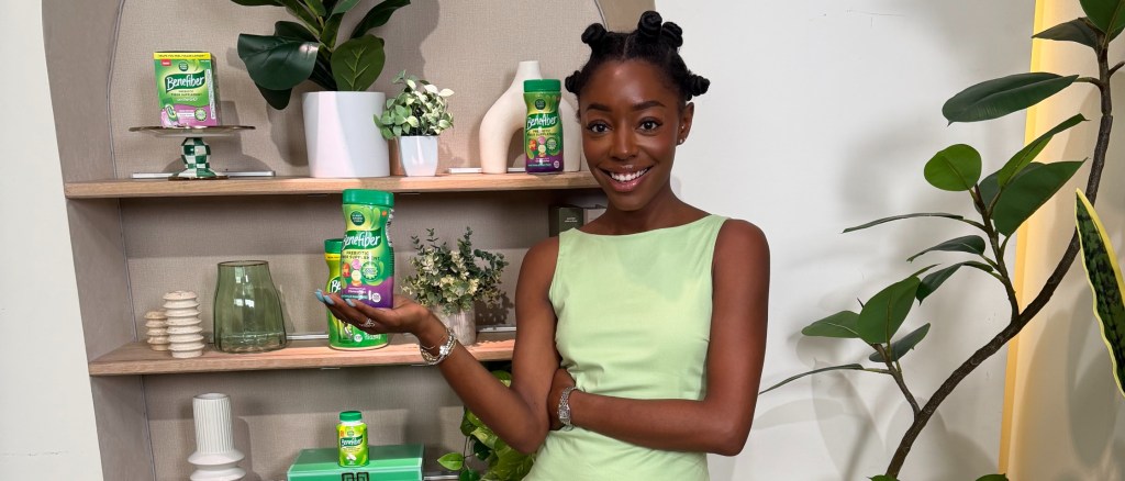 Venita Aspen holding a jar of Benefiber