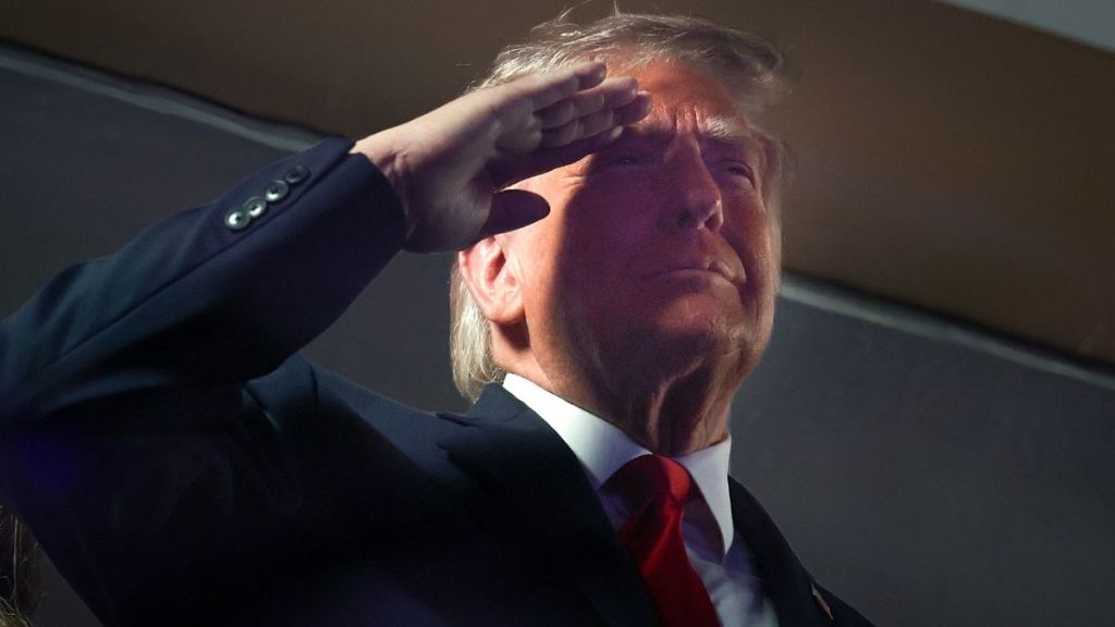Donald Trump’s National Anthem Salute Sparks Questions About Flag Code Rules