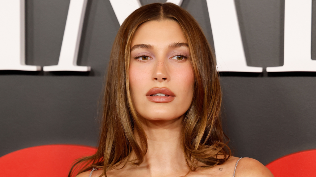 Hailey Bieber's Shirt Tries to Cover Up, but Her Bra Top Has Other Plans