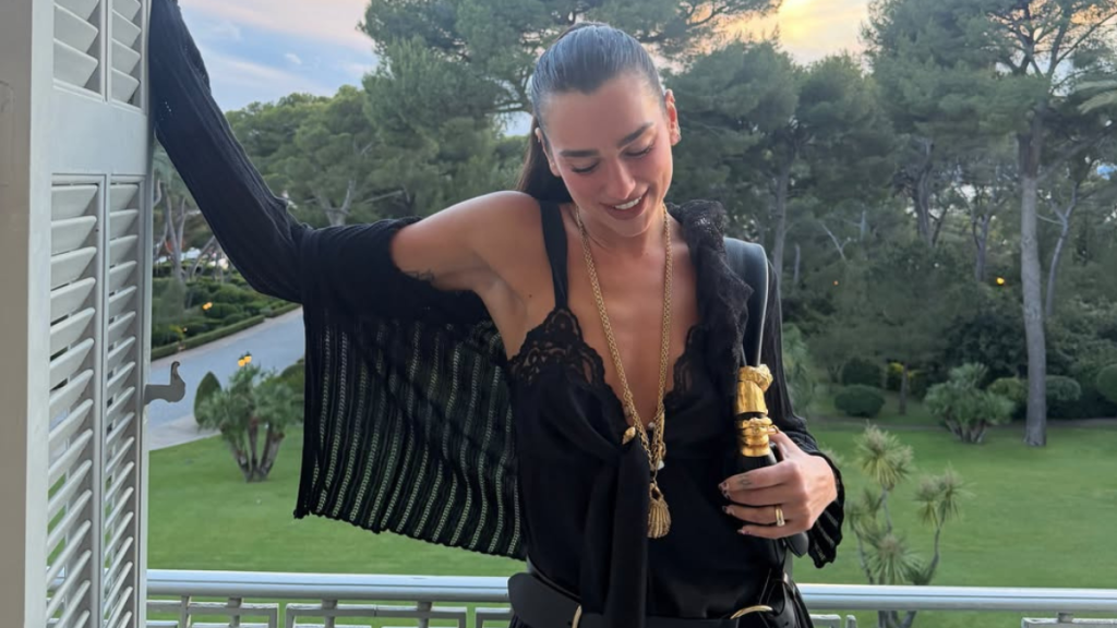 Dua Lipa Styles Lacy Cami Top Hanging by Strings With $5K Schiaparelli Bag