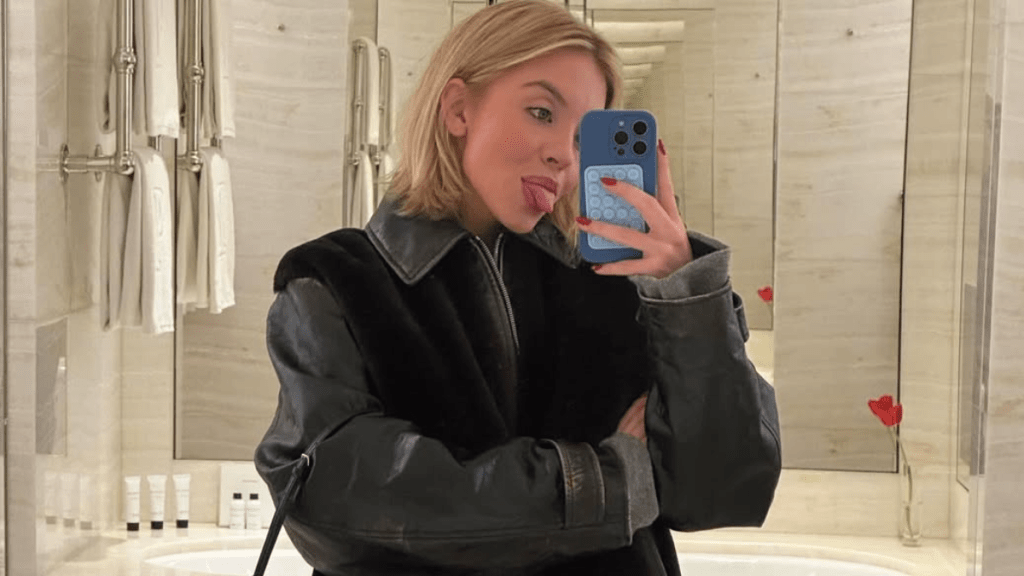 Sydney Sweeney Lounges in Bed for ‘Date Night’ in SYRN Cami & Micro Shorts