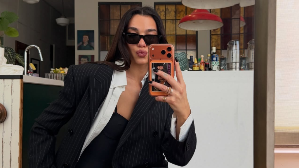 Dua Lipa’s See-Through Ann Demeulemeester Cardigan Reveals Lacy Chloe Top