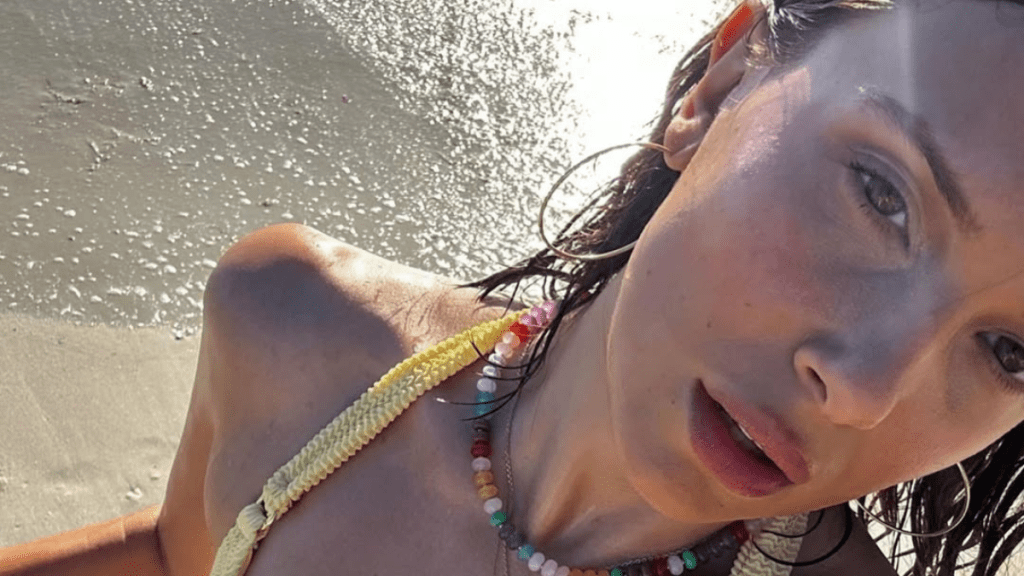 Millie Bobby Brown rocks a nude plunging top and see-through skirt for 'Enola Holmes Season 3'