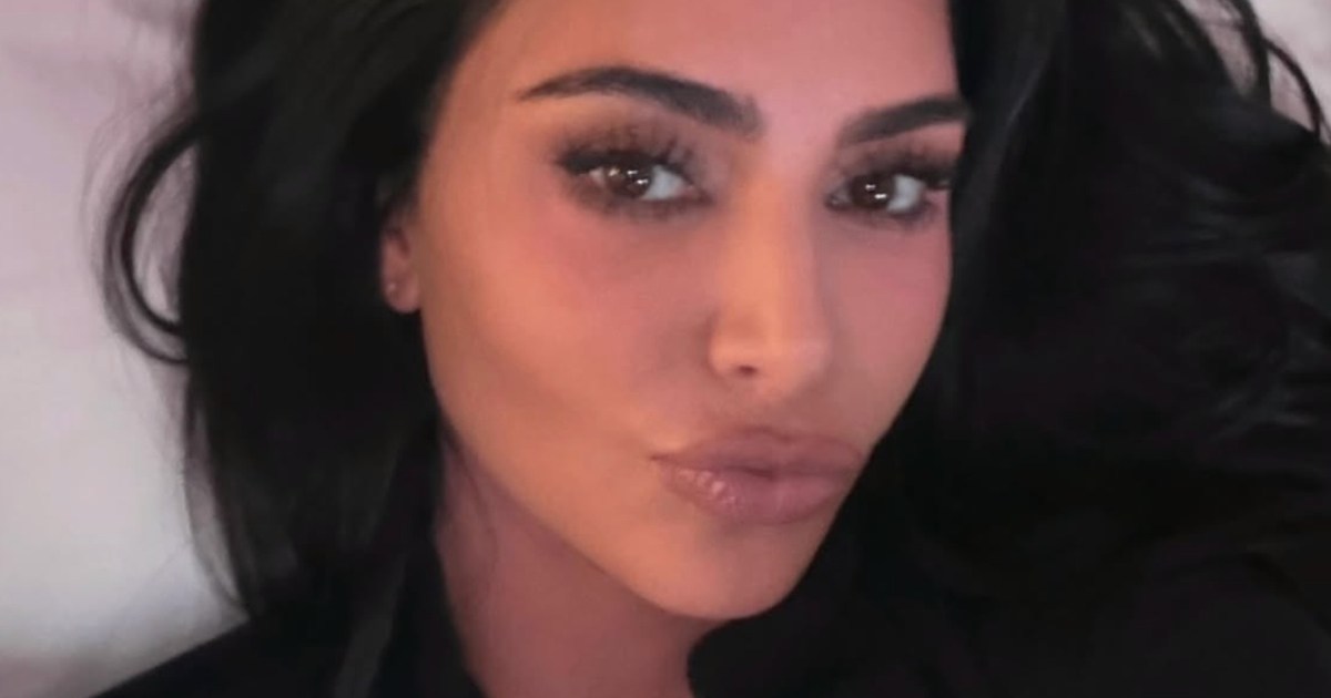 Kim Kardashian's Plunging Dress Puts Her Famous Curves on Full Display