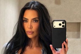 Kim Kardashian Flashes a Hint of Bra in Her Unbuttoned Shirt