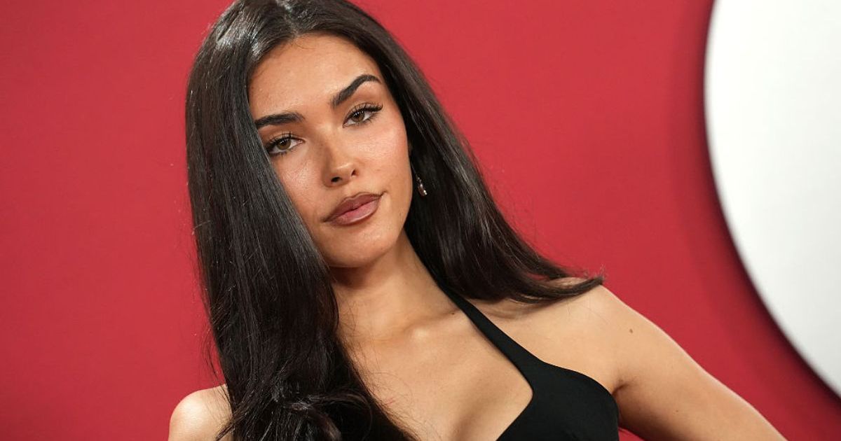 Madison Beer Adjusts Thin Straps of Her Plunging Minidress&hellip;