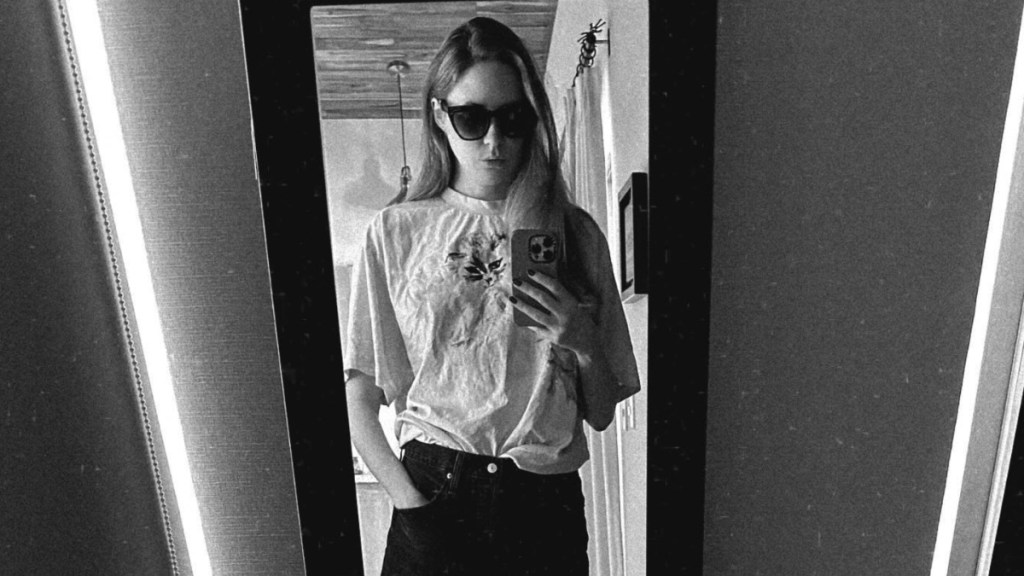 Karen Gillan Spreads Out on Table in Slip Dress That Shows off Her Thighs