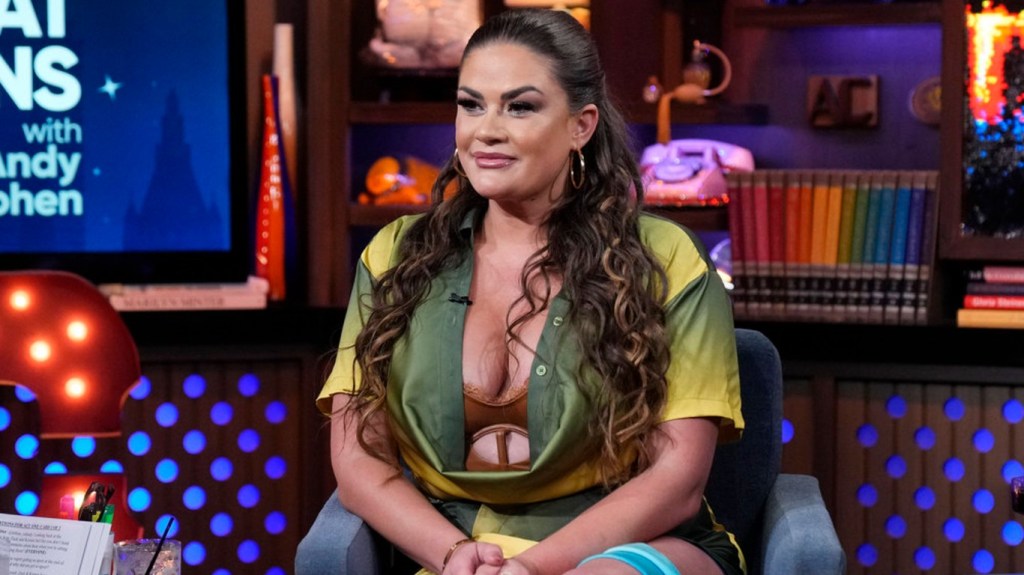 Brittany Cartwright in a green dress on Watch What Happens Live