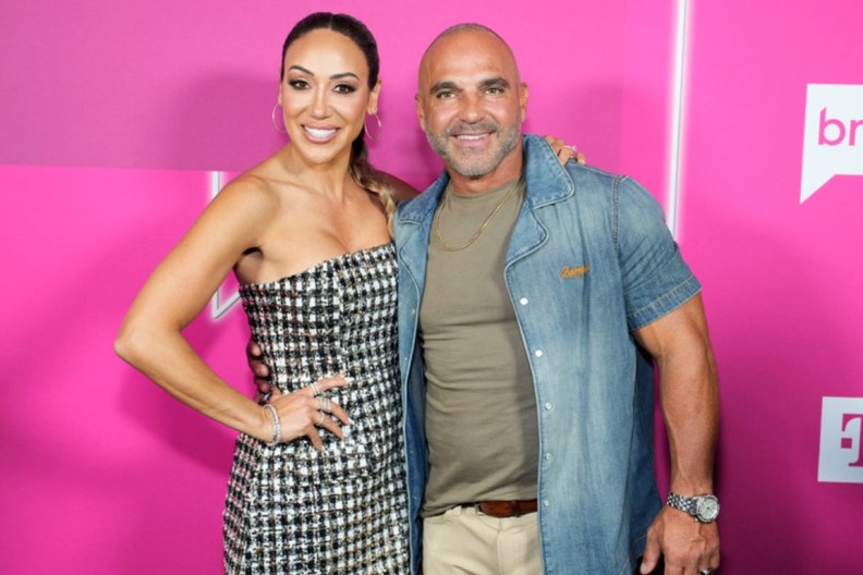 Melissa Gorga and Joe Gorga with their arms around each other at BravoCon 2025