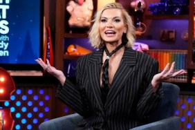 Lindsay Hubbard in a pin striped suit and horse hair tie with her harms out on Watch What Happens Live