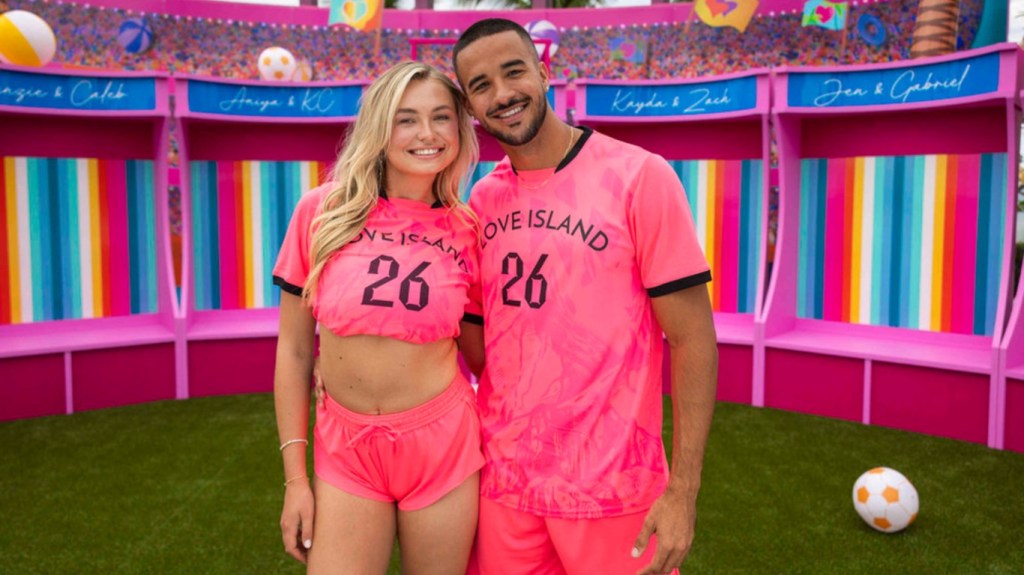 Jen and Gabriel in matching pink soccer jerseys on Love Island USA