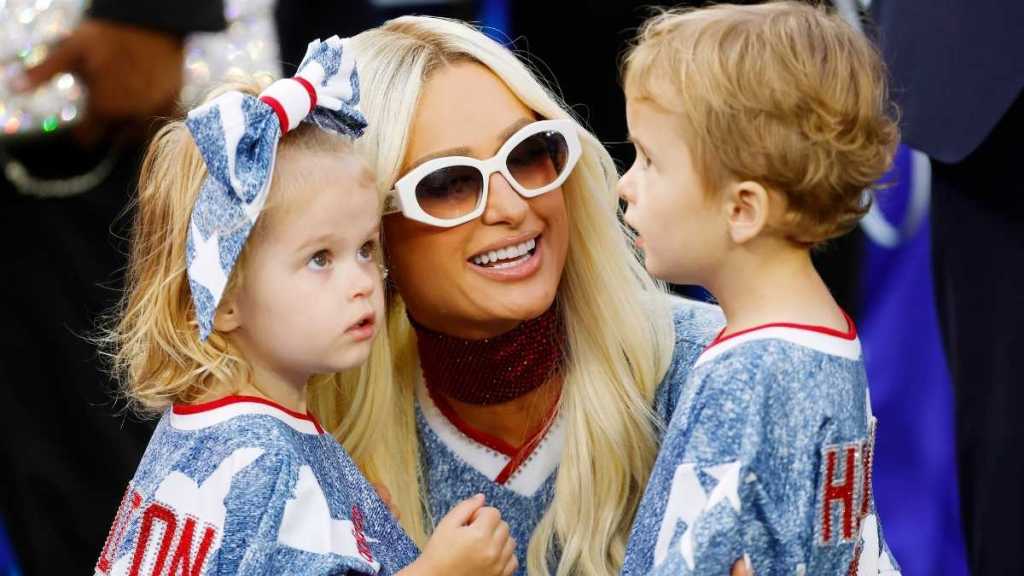 Paris Hilton Matches Her Kids in Adidas Micro Miniskirt & Thigh-High Boots
