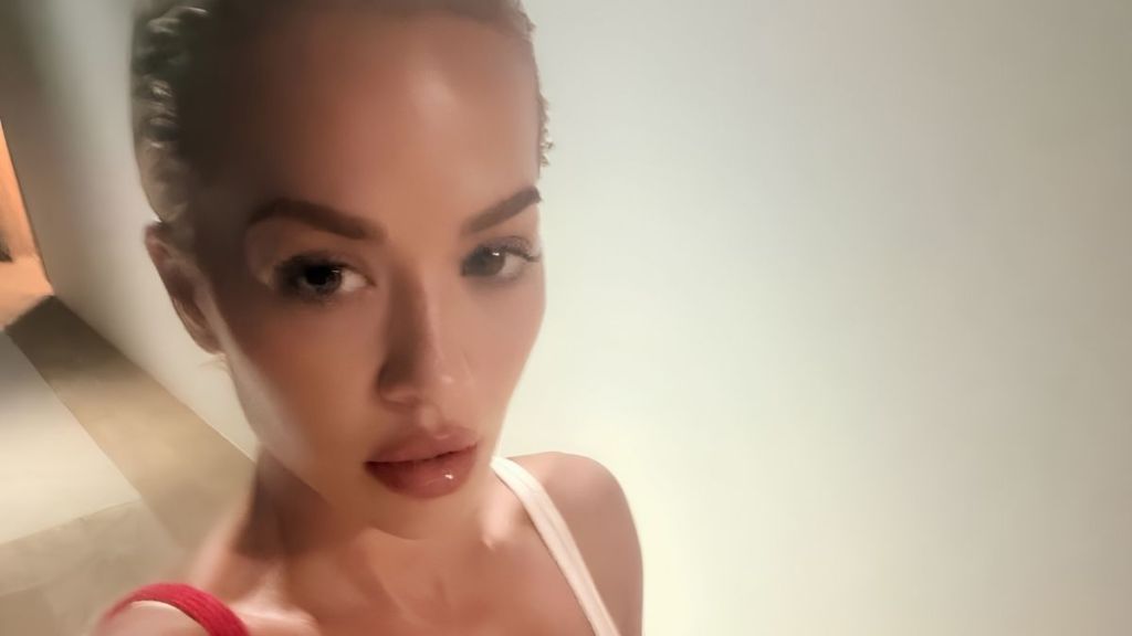 Rita Ora Goes Wild in Tiny Bra-Top & Bold Cutout Mini Skirt on Stage