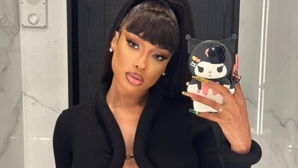 Megan Thee Stallion Lounges in Plunging Dress That Dips Front & Back