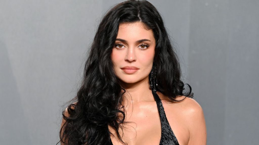 Kylie Jenner Lounges Beachside in Skimpy Camo String Bikini
