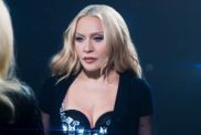 Madonna Twists & Turns on Table in Plunging Bodysuit