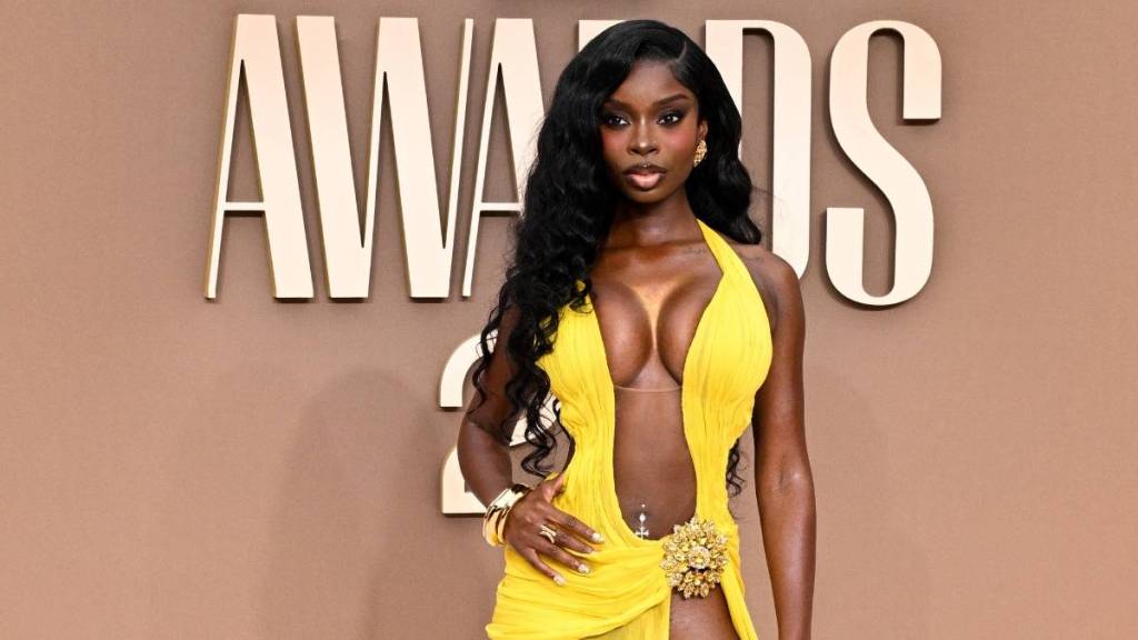 Olandria Carthen’s Sheer Theo Philio Dress’ Neckline Meets Its High Slit at BET Awards