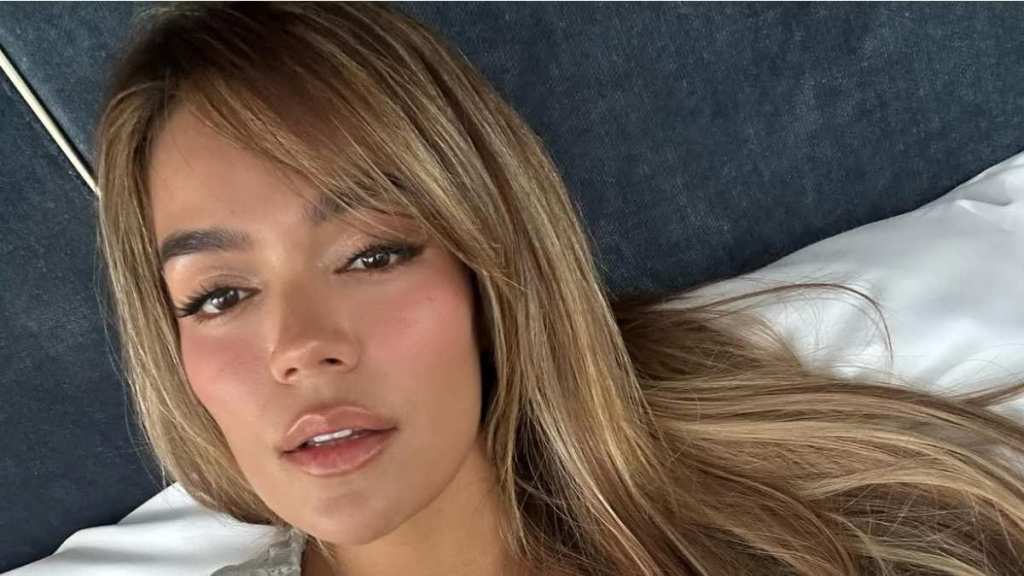 Karol G's Zipped-Down Body-Hugging Top Leaves Very Little Covered