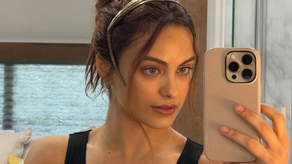 Camila Mendes Puts Her Toned Midriff on Display in Bikini Top & Micro Mini