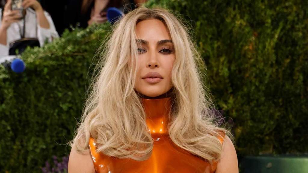 Kim Kardashian Flaunts Her Famous Curves in Nearly Unzipped Bodysuit