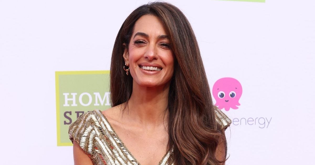Amal Clooney’s Vintage Mugler Fringe Top Hangs by a Single Strap in Italy Amal Clooney’s Vintage Mugler Fringe Top Hangs by a Single Strap in Italy