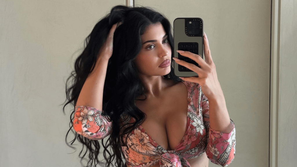 Kylie Jenner's Deeply Plunging Neckline Distracts From Open-Back Top