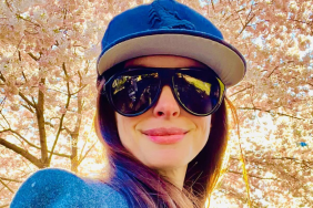 Anne Hathaway Kicks off ‘The Odyssey’ Press Tour While Cradling Baby Bump
