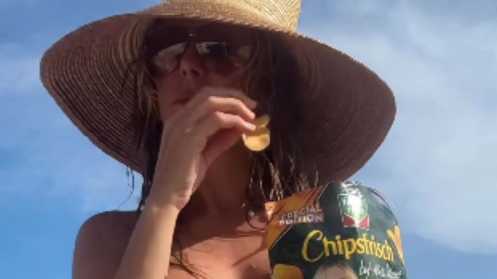 Heidi Klum Goes Topless in Nothing but Bikini Bottoms While Eating Chips
