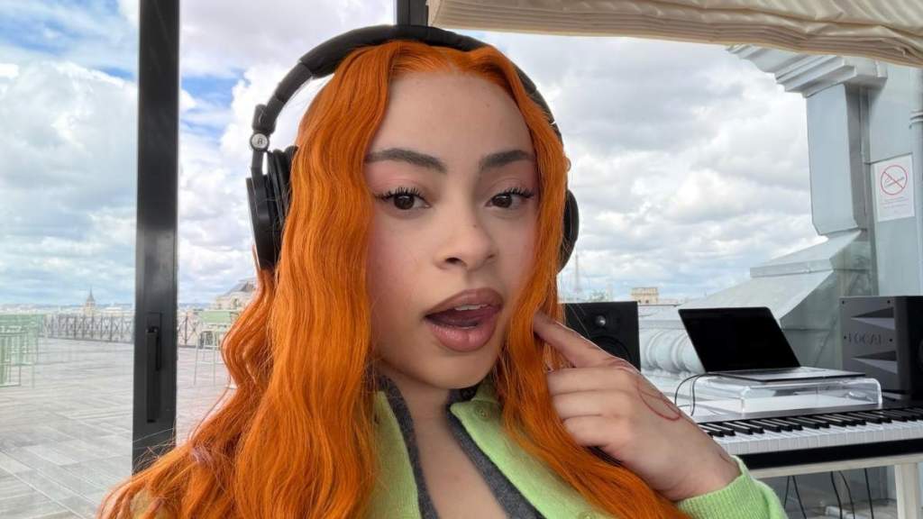 Ice Spice Strikes a Bold Pose as Her Mini Dress Rides Higher